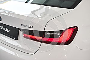 Vinnitsa, Ukraine - February 24, 2021.  Rear headlight of BMW Series 3 - new model car presentation in showroom