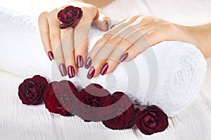 Vinous manicure with rose flowers. spa