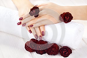 Vinous manicure with rose flowers. spa