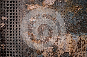 The vintag rusty grunge steel decorated by drilling a wall textured background. photo