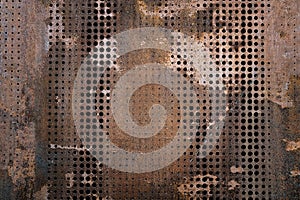 The vintag rusty grunge steel decorated by drilling a wall textured background. photo