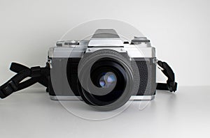 Vintage 35mm film analogue SLR camera on white background