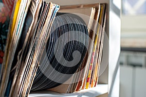 Vintage 45s vinyl row on house shelf