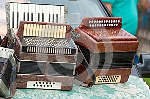 vintage accordion. a portable musical instrument with metal reed photo