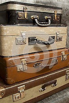 Vintage, aged suitcases on stack
