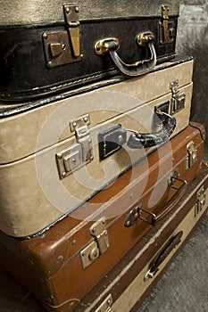 Vintage, aged suitcases on stack