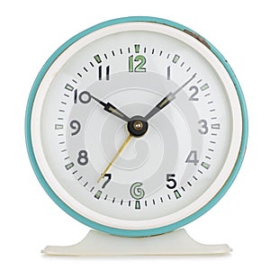 Vintage alarm clock analog in green metal round case isolated