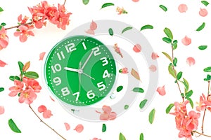 Vintage alarm clock flat lay with colorful springtime decoration