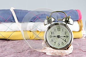 Vintage alarm clock and measure tape