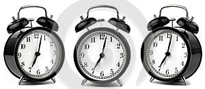 vintage alarm clock set at 7 o`clock in the morning in three angles