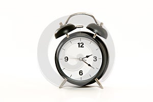 Vintage alarm clock with simple and minimalist design, isolated on white background. Second arm in movement - passing of time.