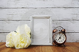 Vintage alarm clock and space photo frame