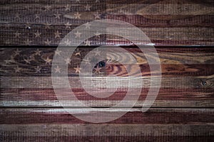 Vintage American Flag painted on an aged, weathered rustic wooden Background.