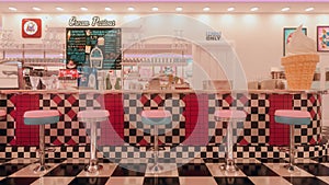 3D rendering of vintage American ice cream parlour with black and white checked floor and pink stools at the bar. photo