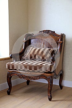 Vintage antique armchair in the room