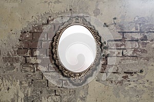 Vintage antique mirror on old brick wall background texture