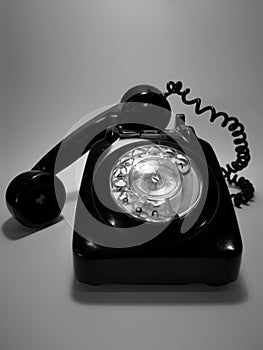 A vintage and antique telephone with white background.