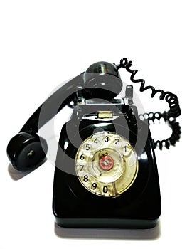 A vintage and antique telephone with white background.