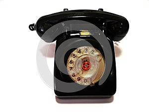 A vintage and antique telephone with white background.