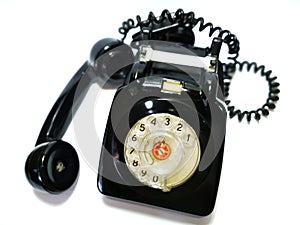 A vintage and antique telephone with white background. photo