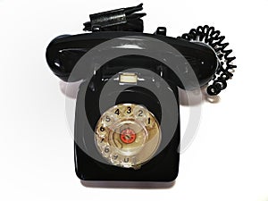 A vintage and antique telephone with white background. photo