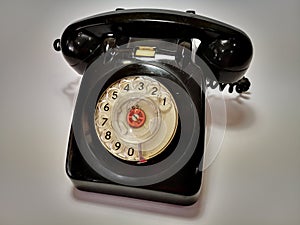 A vintage and antique telephone with white background. photo