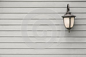 Vintage Antique wall lamp on grey wood wall, for background with