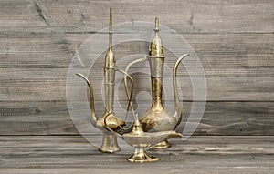 Vintage arabic jug, vase, lamp, teapot. Golden oriental decorations