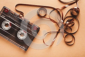 Vintage audio cassette on brown background