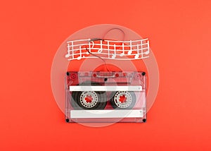 Vintage audio cassette with loose tape shaping a heart