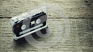 Vintage audio cassette tapes on wooden background.