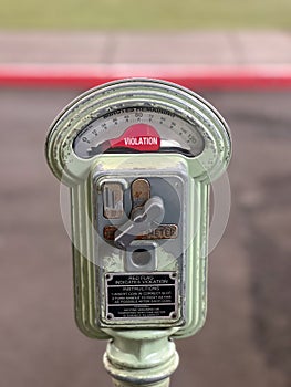 Vintage authentic parking meter on city street