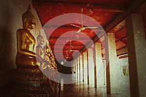 Vintage background,buddha statue golden color at temple watt pho Bangkok Thailand Asia