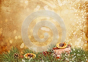 Vintage background with candied oranges, cinnamon, fir-tree branches and christmas gift. Season`s greetings