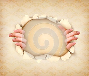 Vintage background with hands showing trough a hol