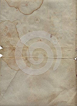 Vintage background of old ancient torn paper texture with spots