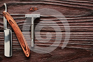 Vintage barber shop razor tools on wooden background