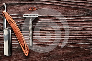 Vintage barber shop razor tools on wooden background