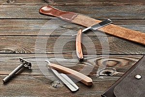 Vintage barber shop razor tools on wooden background