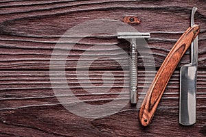 Vintage barber shop razor tools on wooden background