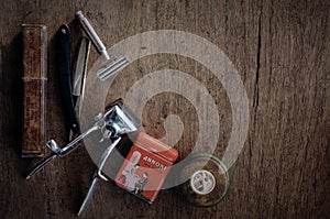 Vintage barber shop tools on wood texture background