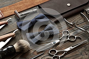 Vintage barber shop tools on wooden background