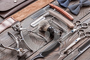 Vintage barber shop tools on wooden background