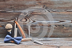 Vintage barber shop tools on wooden background