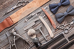 Vintage barber shop tools on wooden background