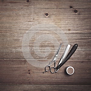 Vintage barber tools on wood desk