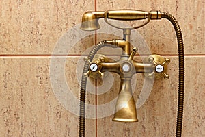 Vintage bathtub faucet and ceramic tiles