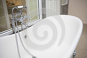 Vintage bathtub with faucet and shower in bathroom