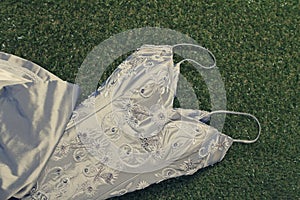 Vintage beaded wedding dress on grass
