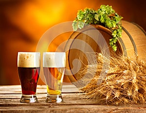 Vintage beer barrel and two glasses. Brewing concept